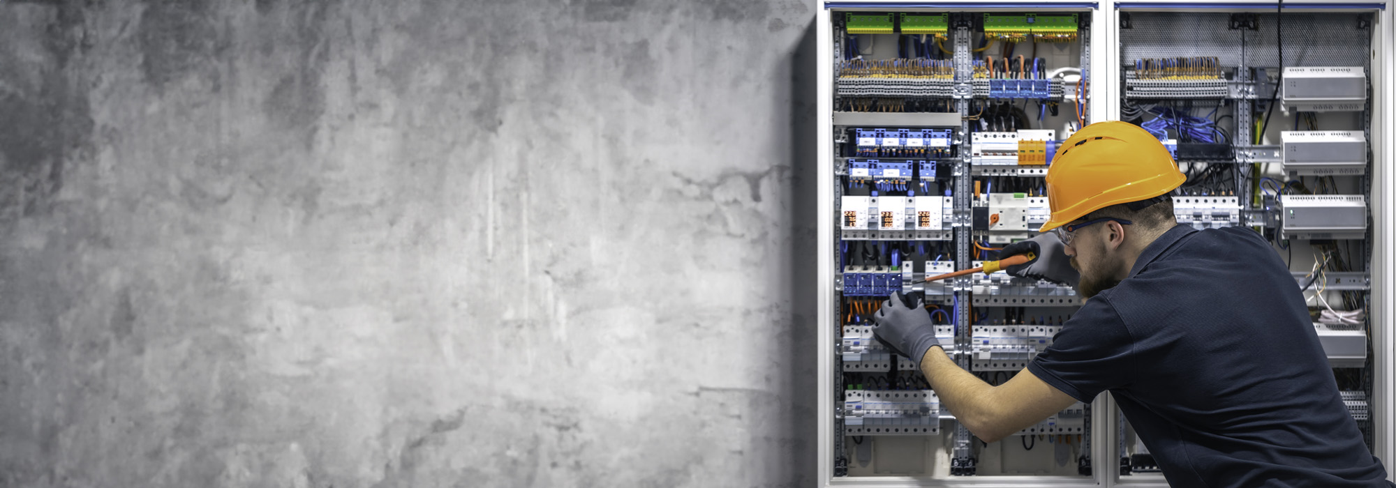 electrician working switchboard with electrical connection cable copy space