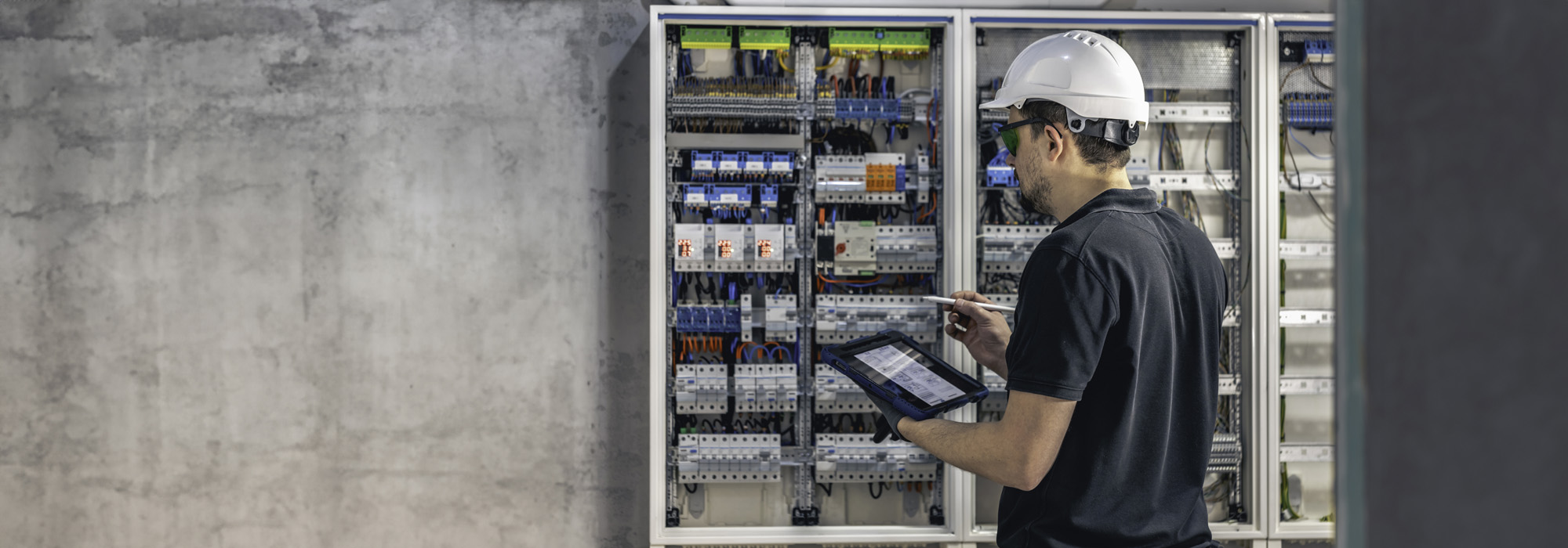 electrician working switchboard with electrical connection cable copy space